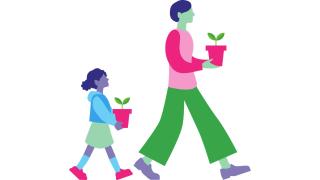 Aikuinen ja lapsi kävelevät kasvit käsissään.